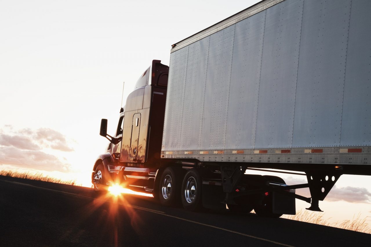 Commercial freight truck driving on a highway